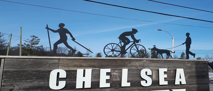 bridge with statues of peoples skiing, cycling, and running