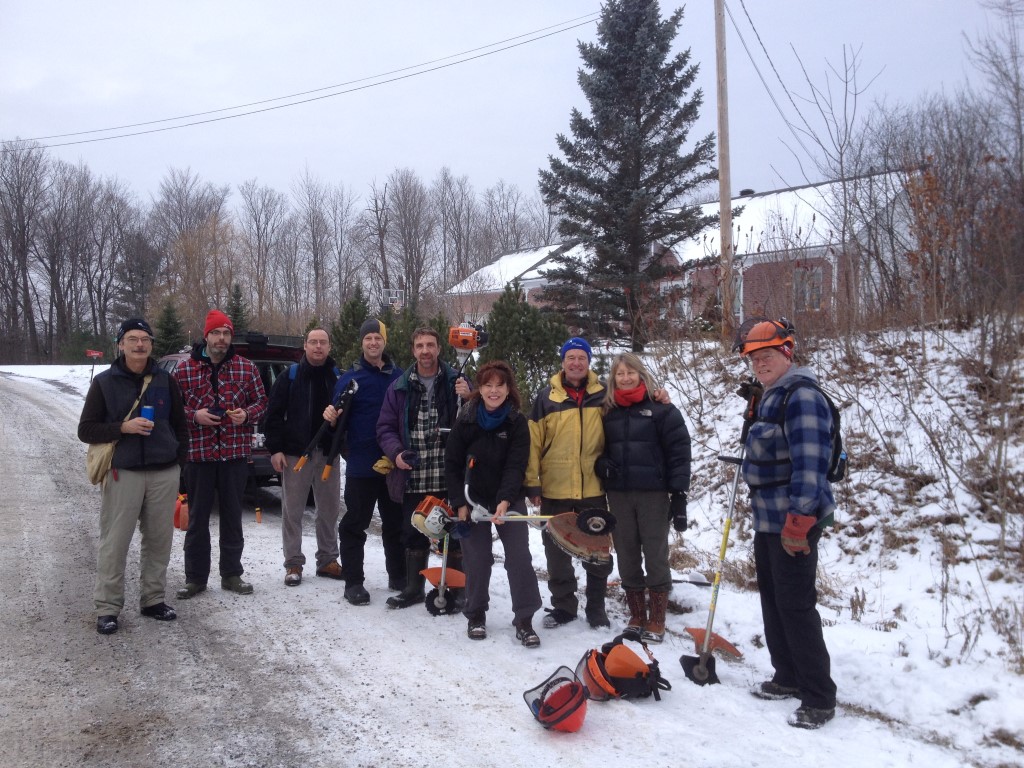 large group of people volunteering in the winter